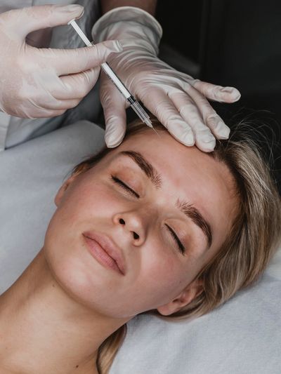 young woman getting beauty injection